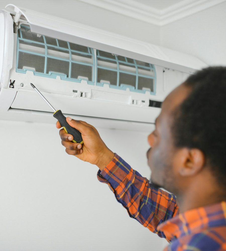 AC Electrician Technician Repairing Air Conditioner Appliance